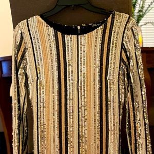 Twinkling sequins dress for any cocktail hour.